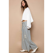 Bestseller “The Conrad” Distressed drawstring waist snap stripe denim wide leg pant